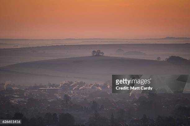 The sun begins to rise over the town of Warminster viewed from the National Trust's Cley Hill, as the country wakes up to sub-zero temperatures, on...