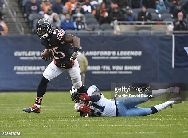 Da'Norris Searcy of the Tennessee Titans tackles Brandon Boykin of the Chicago Bears during the third quarter on November 27, 2016 at Soldier Field...