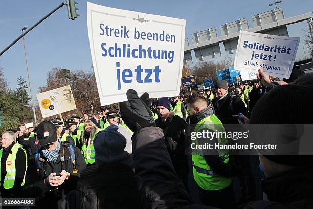 Lufthansa ground crews protest against a gathering of striking Lufthansa pilots who had gathered outside Lufthansa headquarters at Frankfurt Airport...