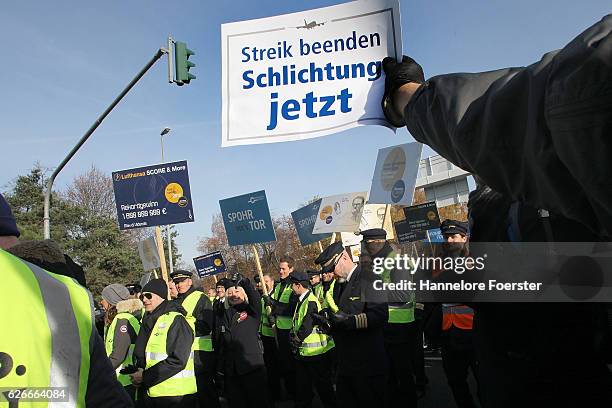 Lufthansa ground crews protest against a gathering of striking Lufthansa pilots who had gathered outside Lufthansa headquarters at Frankfurt Airport...