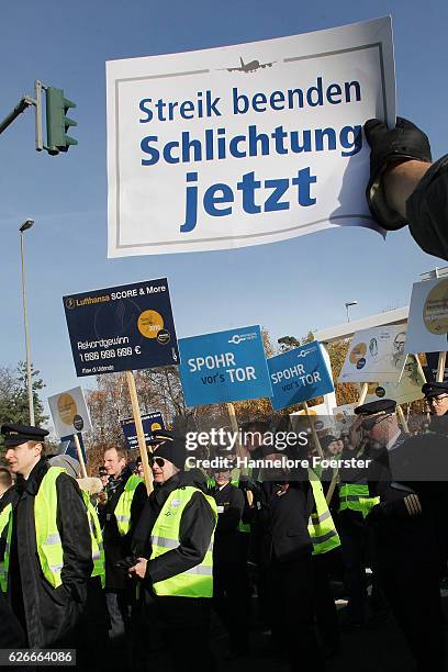 Lufthansa ground crews protest against a gathering of striking Lufthansa pilots who had gathered outside Lufthansa headquarters at Frankfurt Airport...