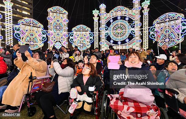 Disabled and handcapped people enjoy the Kobe Luminarie at the Heatful Day ahead of the official opening on November 30, 2016 in Kobe, Hyogo, Japan....