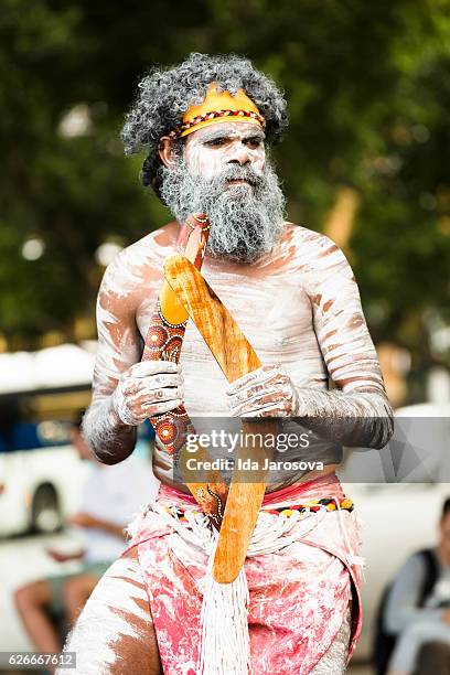 aboriginal male dancing with boomerangs, sydney australia - boomerang stock pictures, royalty-free photos & images