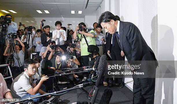 Japan - Masakiyo Maezono, a former Japan national soccer team star, apologizes at a press conference in Tokyo after being released by police on Oct....