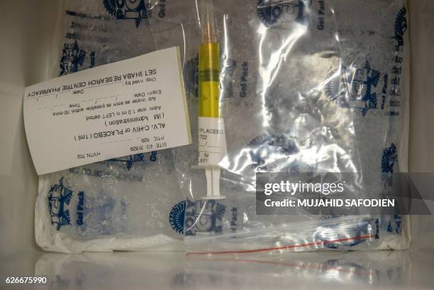 Picture taken on November 30, 2016 shows an experimental vaccine against the AIDS virus in Shoshaguve, near Pretoria. South Africa on November 30...