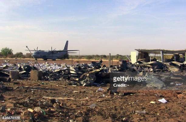 Picture taken on November 30, 2016 shows debris at the airport of Gao following a suicide car bomb attack revendicated by the Algerian jihadist group...