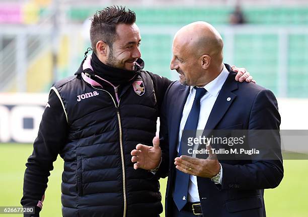 Headcoache Domenico Di Carlo of Spezia speaks with Head Coach Roberto De Zerbi of Palermo during the TIM Cup A match betweenUS Citta di Palermo and...