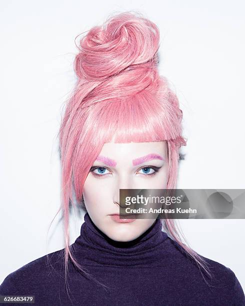 young woman with pink hair wig in an updo. - perücke stock-fotos und bilder