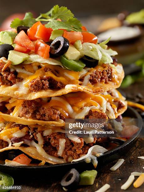 chilli cheese tostada tower - tostada stock pictures, royalty-free photos & images