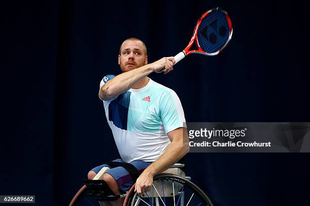 Maikel Scheffers of Holland in action during his match against Argentina's Gustavo Fernandez on Day 1 of NEC Wheelchair Tennis Masters at Queen...