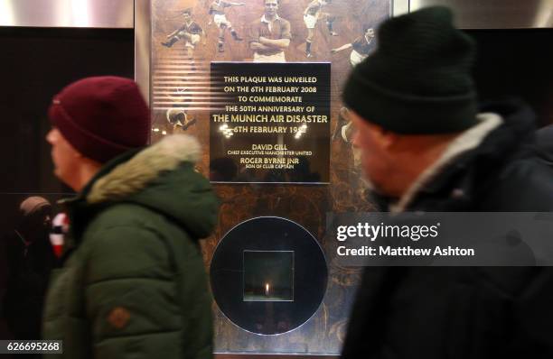 Fans of Manchester United remember the players who died in the Munich Air Disaster on February 6th 1958 by looking at the museum plaques in the...