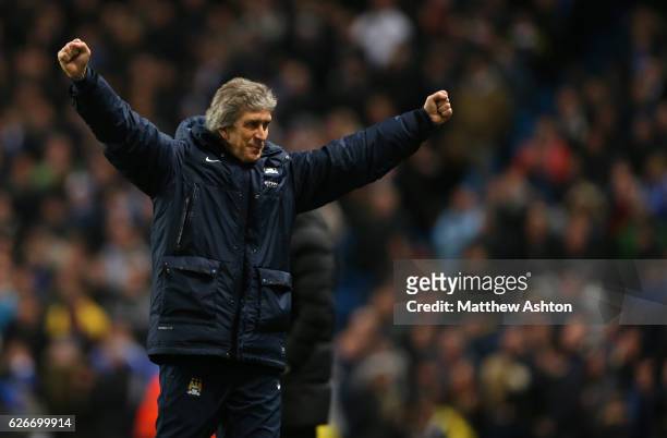 Manuel Pellegrini the head coach / manager of Manchester City celebrates as his team go 2-0 in front
