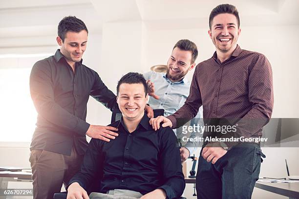 group of young coworkers making fun of colleague in office - massage funny stock pictures, royalty-free photos & images