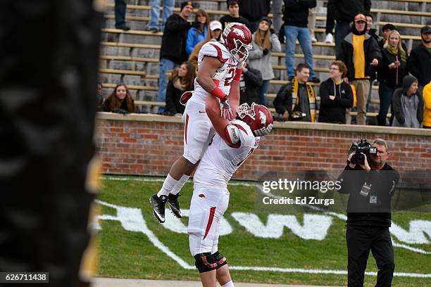 Running back Devwah Whaley of the Arkansas Razorbacks celebrates his touchdown with offensive lineman Dan Skipper of the Arkansas Razorbacks against...