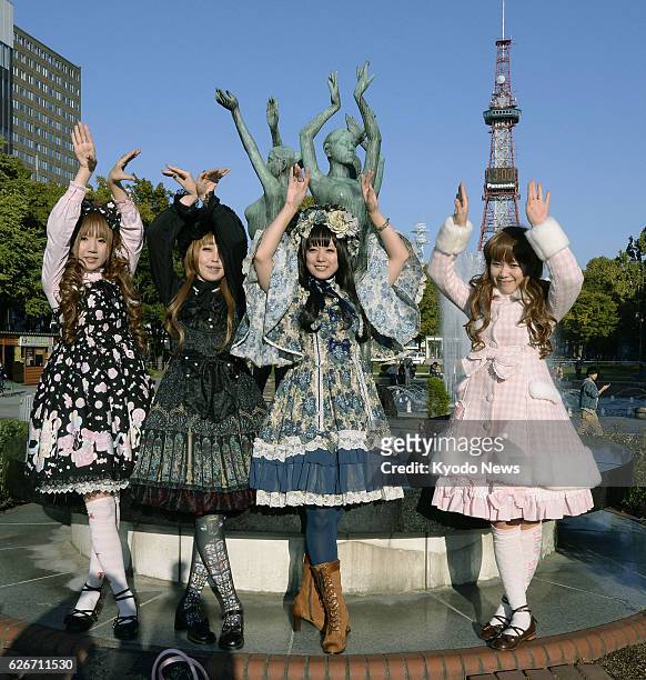 Japan - Four women clad in the so-called Lolita fashion pose for photos in Odori Park in Sapporo, Hokkaido, northern Japan, during an event on Oct....