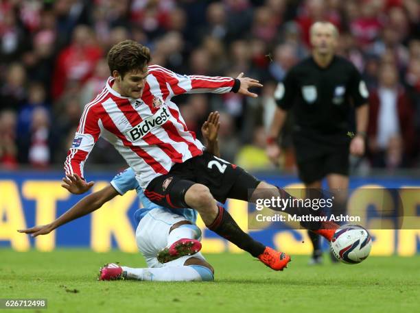 Marcos Alonso of Sunderland is tackled by Fernandinho of Manchester City