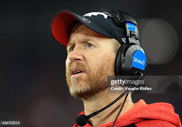 Head Coach Dave Dickenson of the Calgary Stampeders looks on from the sidelines during the 104th Grey Cup Championship Game against the Ottawa...