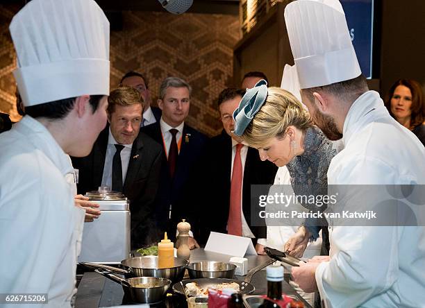 Queen Mathilde of Belgium visits the Sligro Foodgroup Netherlands on November 30, 2016 in Veghel, Netherlands.