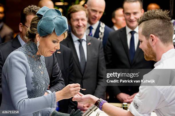 Queen Mathilde of Belgium visits the Sligro Foodgroup Netherlands on November 30, 2016 in Veghel, Netherlands.