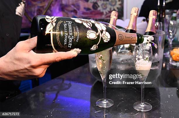 Glasses of Perrier-Jouet being poured at the L'Eden By Perrier-Jouet opening night in partnership with Vanity Fair at Casa Faena on November 29, 2016...