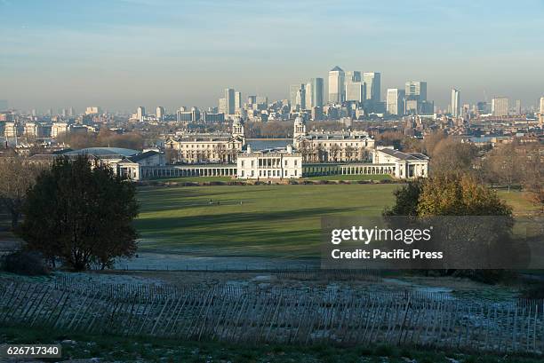 View of skyscrapers of Canary Wharf from the Greenwich Observatory. The financial district of Canary Wharf has plenty of skyscrapers including One...