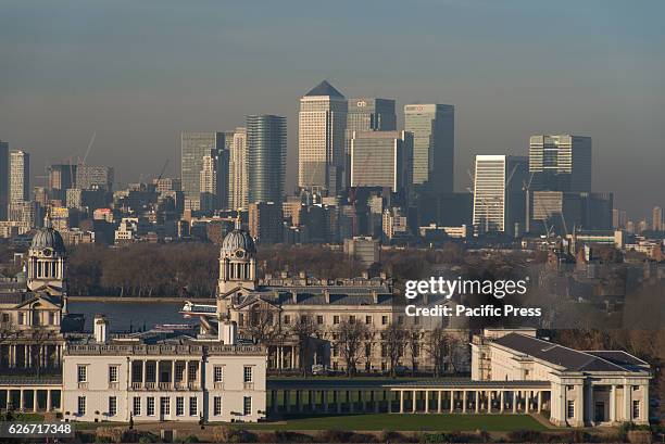 View of skyscrapers of Canary Wharf from the Greenwich Observatory. The financial district of Canary Wharf has plenty of skyscrapers including One...