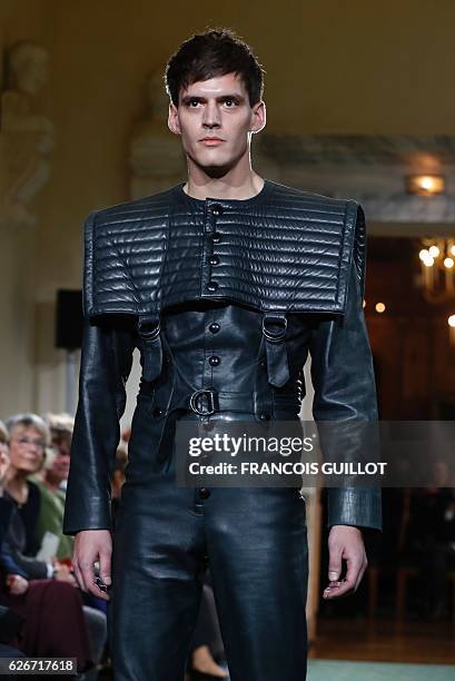 Model presents a creation by French fashion designer Pierre Cardin during a retrospective show at the Institut de France, on November 30, 2016 in...