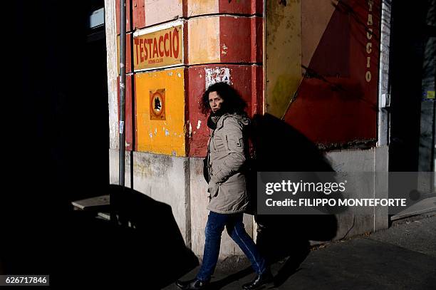 Small head of wolf, symbol of the AS Roma football club, is painted on a wall in the Testaccio district on November 30, 2016 in Rome. Rome's football...