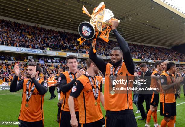 Ethan Ebanks-Landell of Wolverhampton Wanderers celebrates winning the league One title with the trophy