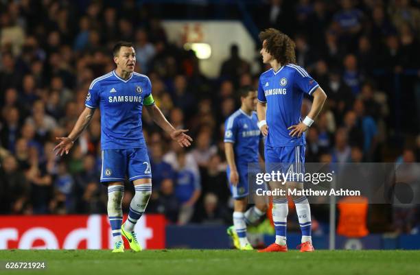 Frustrated John Terry of Chelsea shouts at a dejected David Luiz of Chelsea after Atletico Madrid score to make 1-3