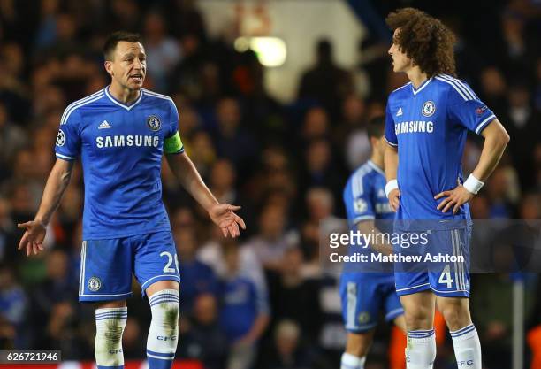 Frustrated John Terry of Chelsea shouts at a dejected David Luiz of Chelsea after Atletico Madrid score to make 1-3