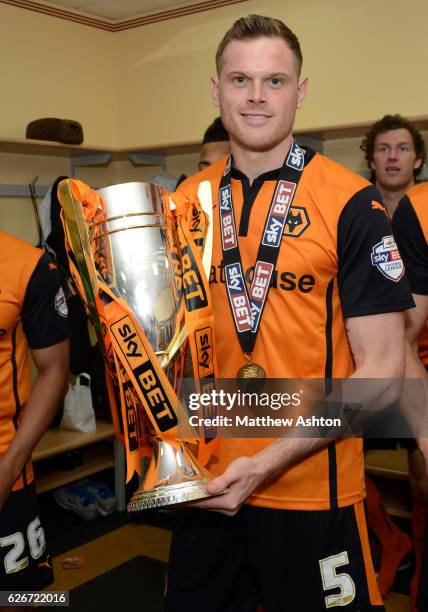 Richard Stearman of Wolverhampton Wanderers celebrates winning the league One title with the trophy