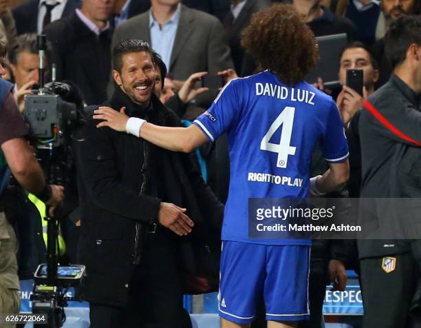 David Luiz of Chelsea congratuates a smiling Diego Simeone Manager / head coach of Atletico Madrid