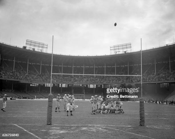With mixed emotions, players on both teams watch closely as the kick by Cleveland's Lou Groza sails cleanly between the uprights for a field goal and...
