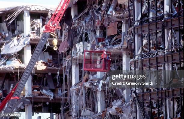 Investigators seach the remains of the Alfred P. Murrah Building the day after the bombing. --- Photo by Greg Smith/Corbis SABA