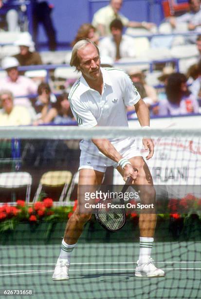Stan Smith of the United States hits a return during the Men's 1979 US Open Tennis Championships circa 1979 at the USTA Tennis Center in the Queens...