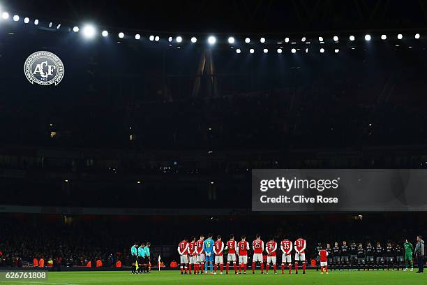 The Arsenal team observe a minutes silence ahead of the EFL Cup quarter final match between Arsenal and Southampton at the Emirates Stadium on...