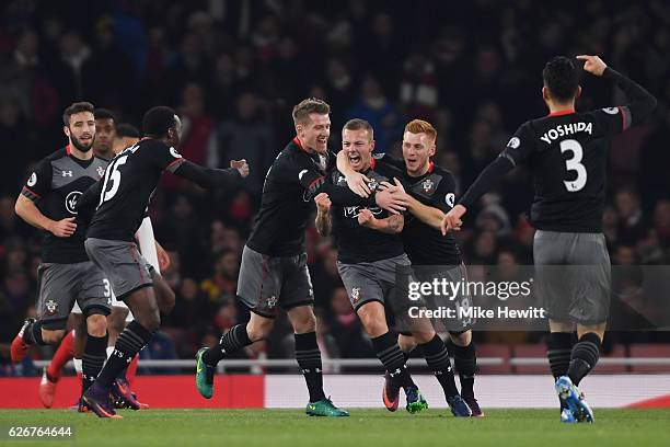 Jordy Clasie of Southampton celebrates with team mates after scoring the opening goal of the game during the EFL Cup quarter final match between...