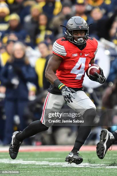 Curtis Samuel of the Ohio State Buckeyes runs with the ball against the Michigan Wolverines at Ohio Stadium on November 26, 2016 in Columbus, Ohio....