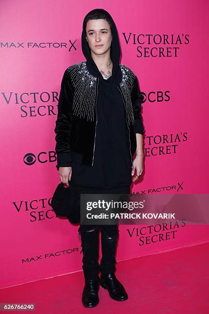 French model and DJ Agathe Mougin poses on the pink carpet upon her arrival for the 2016 Victoria's Secret Fashion Show at the Grand Palais in Paris...