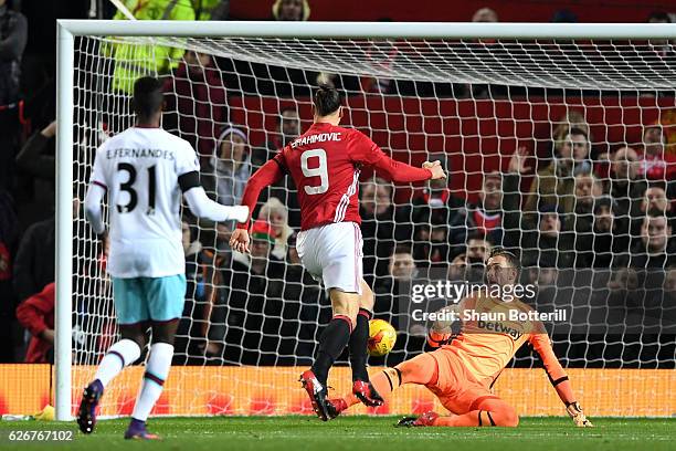 Zlatan Ibrahimovic of Manchester United scores the opening goal past goalkeeper Adrian of West Ham United during the EFL Cup quarter final match...