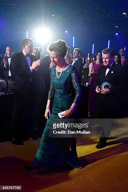 Princess Anne, Princess Royal and Chairman of the BOA, Sir Hugh Robertson, walk up to the stage as they attend the Team GB Ball at Battersea...