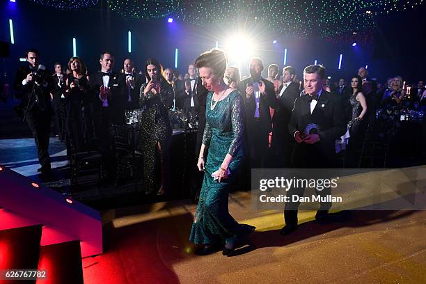 Princess Anne, Princess Royal and Chairman of the BOA, Sir Hugh Robertson, walk up to the stage as they attend the Team GB Ball at Battersea...