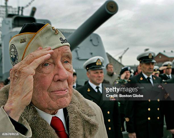 Barney Murphy salutes during the annual Pearl Harbor Survivors Association and Friends Memorial Service on the deck of the USS Cassin Young DD-79 at...
