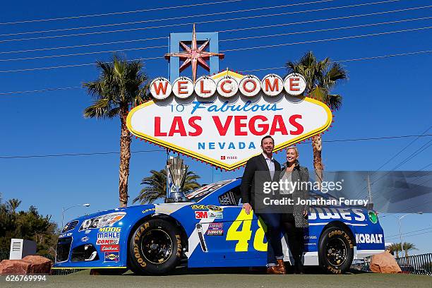 Sprint Cup Series champion crew chief Chad Knaus and Brooke Werner pose in front of the Welcome to Fabulous Las Vegas sign during NASCAR Champion's...