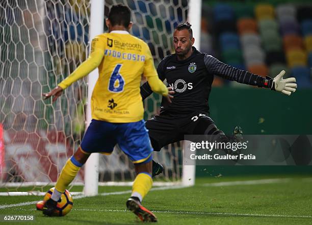 Sporting CP's goalkeeper Beto with FC Arouca's defender from Brazil Vitor Costa during the Portuguese League Cup match between Sporting CP and FC...