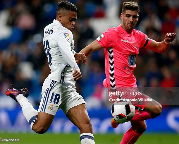 Mariano Diaz of Real Madrid scores his team's third goal past Ivan Gonzalez of Cultural y Deportiva Leonesa during the Copa del Rey round of 32...