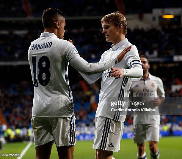 Mariano Diaz of Real Madrid CF celebrates after scoring Real's 3rd goal whit is teammates Marin Odegaard during the Copa del Rey last of 32 match...