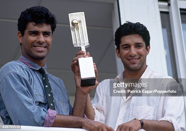 Pakistan bowlers Waqar Younis and Wasim Akram with the Cornhill Trophy after Pakistan won the 5th Test match between England and Pakistan at The...