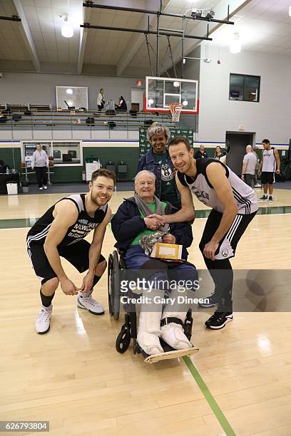 Matthew Dellavedova Steve Novak of the Milwaukee Bucks as part of the NBA Cares Hoops for Troops program, military veterans attend the Milwaukee...